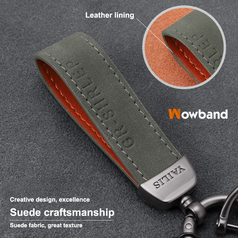 Porte-clés dinosaure en métal avec cordon en daim